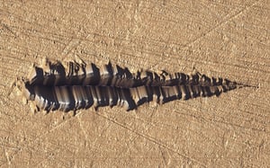 Scratch test topography providing quantitative data on material hardness and wear resistance.