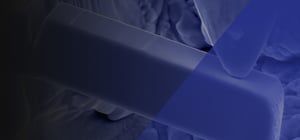 In-situ microcantilever fracture testing with a blue overlay, used as a background image.