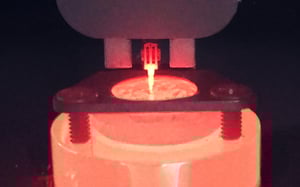 Nanoindenter performing a high-temperature test on a heated specimen.
